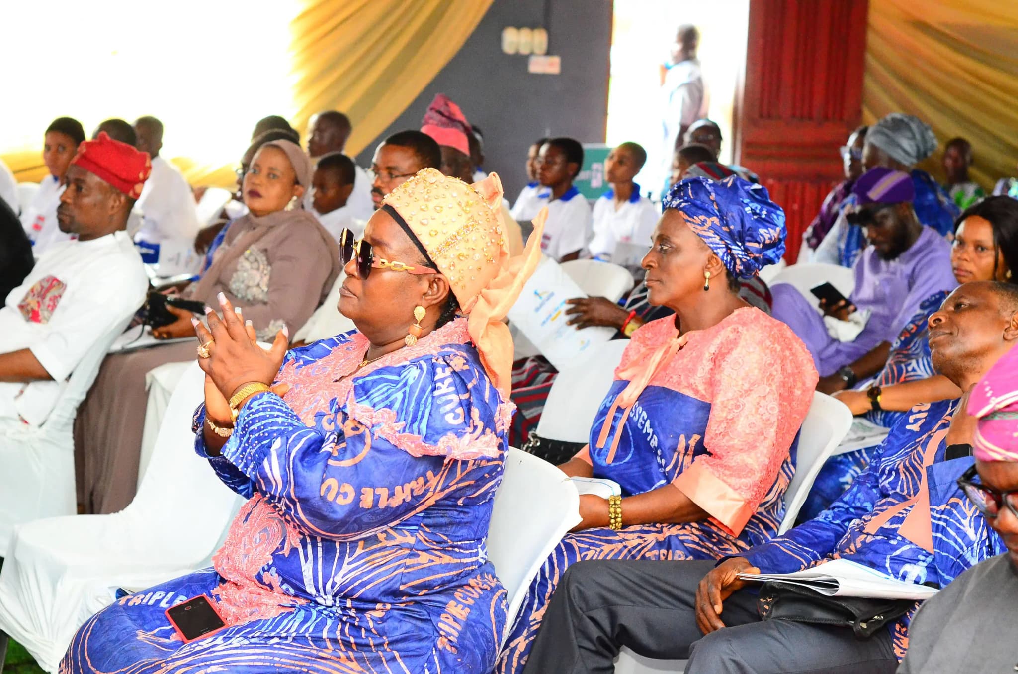 Triple Cure Assembly team member interacting with students at the annual scholarship event