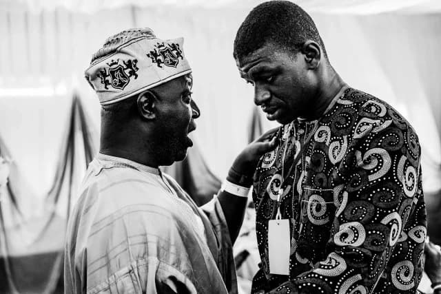 Emotional moment with the first son of the family with an elder at the memorial event.